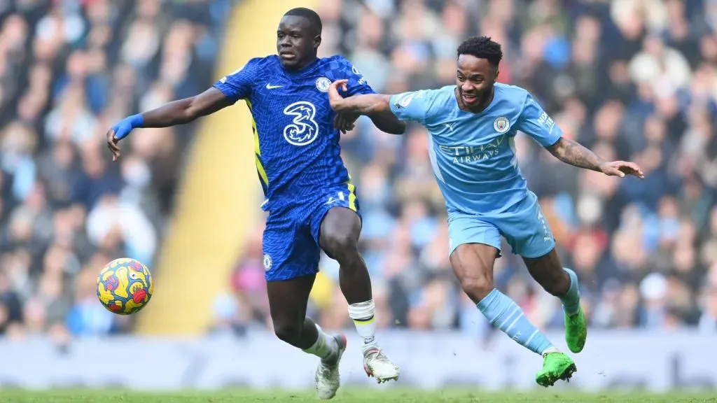 Raheem Sterling of Manchester City battles for possession with Malang Sarr of Chelsea during the Premier League match between Manchester City and Chelsea at Etihad Stadium on January 15, 2022 in Manchester, England. (Photo by Laurence Griffiths/Getty Images)