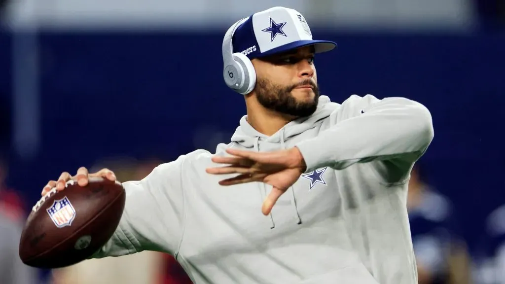 Dak Prescott warms up before a game.