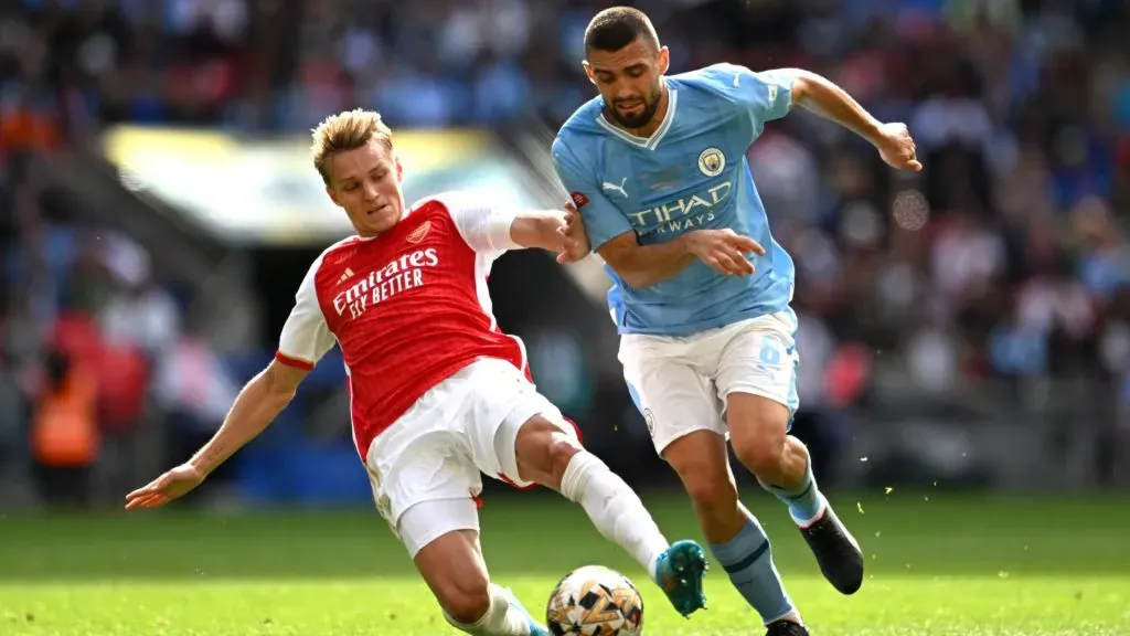 Martin Odegaard of Arsenal battles for possession with Mateo Kovacic of Manchester City