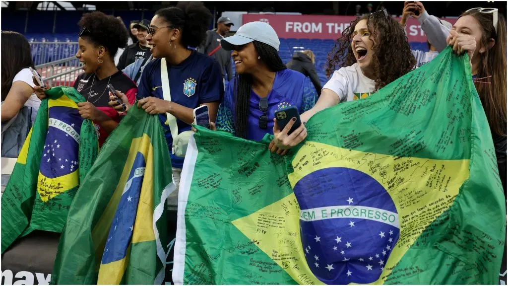 Fans hold Brazil flags – Elsa/Getty Images