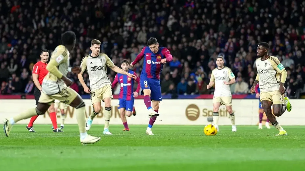 Robert Lewandowski of FC Barcelona scores his team’s second goal during the LaLiga EA Sports match between FC Barcelona and Granada CF at Estadi Olimpic Lluis Companys on February 11, 2024 in Barcelona, Spain. (Photo by Alex Caparros/Getty Images)