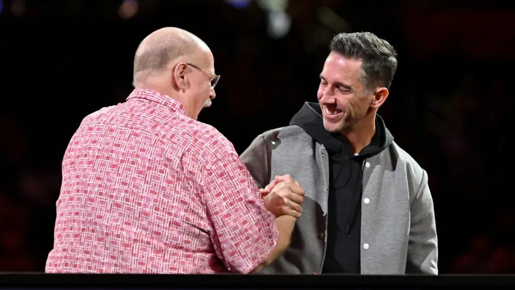 Head coach Andy Reid of the Kansas City Chiefs (L) and head coach Kyle Shanahan of the San Francisco 49ers meet on stage during Super Bowl LVIII Opening Night at Allegiant Stadium on February 05, 2024 in Las Vegas, Nevada.