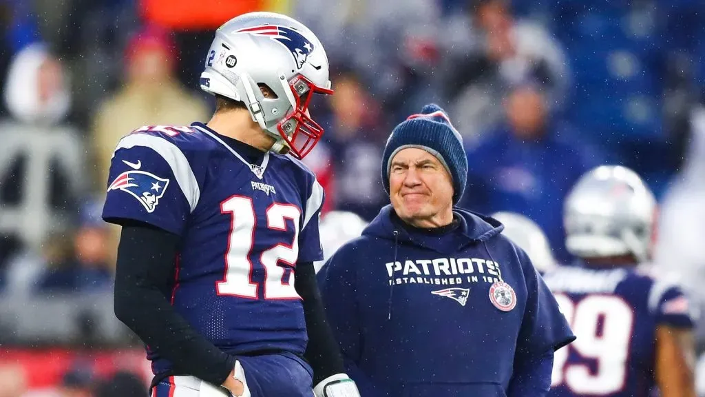 Tom Brady #12 talks to head coach Bill Belichick of the New England Patriots before a game against the Dallas Cowboys at Gillette Stadium on November 24, 2019 in Foxborough, Massachusetts.