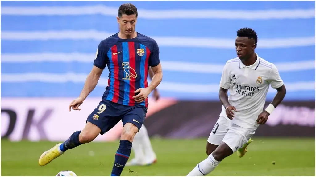 Robert Lewandowski of FC Barcelona and Vinicius Jr. of Real Madrid