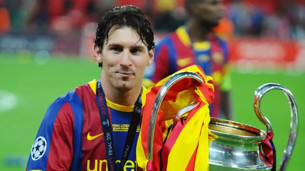 Lionel Messi of FC Barcelona poses with the trophy after victory in the UEFA Champions League final between FC Barcelona and Manchester United FC at Wembley Stadium on May 28, 2011 in London, England.