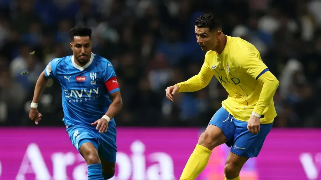 Cristiano Ronaldo of Al-Nassr passes the ball whilst under pressure during the Riyadh Season Cup Final match between Al Hilal and Al-Nassr at Kingdom Arena on February 08, 2024 in Riyadh, Saudi Arabia.