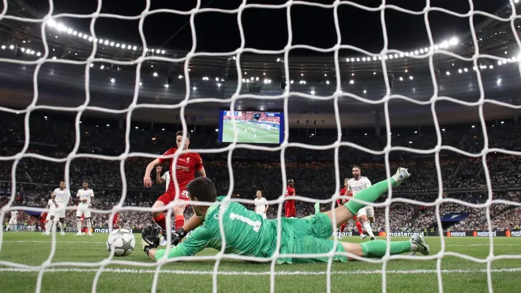 Thibaut Courtois of Real Madrid makes a save from Diogo Jota of Liverpool during the UEFA Champions League final match between Liverpool FC and Real Madrid at Stade de France on May 28, 2022 in Paris, France.