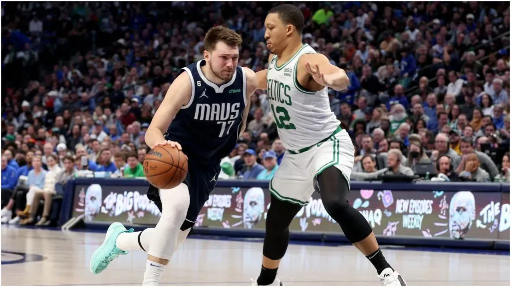 Luka Doncic #77 of the Dallas Mavericks drives to the basket against Grant Williams #12 of the Boston Celtics.