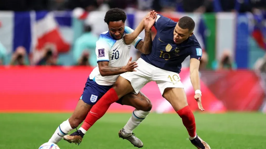 Raheem Sterling of England and Kylian Mbappe of France compete for the ball during the FIFA World Cup Qatar 2022 quarter final match between England and France at Al Bayt Stadium on December 10, 2022 in Al Khor, Qatar.