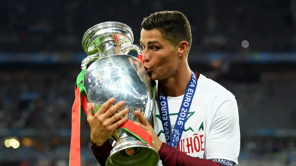 Cristiano Ronaldo of Portugal kisses the Henri Delaunay trophy to celebrate after their 1-0 win against France in the UEFA EURO 2016 Final match between Portugal and France at Stade de France on July 10, 2016 in Paris, France.