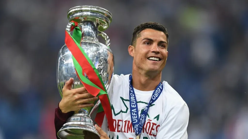 Cristiano Ronaldo of Portugal holds the Henri Delaunay trophy to celebrate after his team’s 1-0 win against France in the UEFA EURO 2016 Final match between Portugal and France at Stade de France on July 10, 2016 in Paris, France.