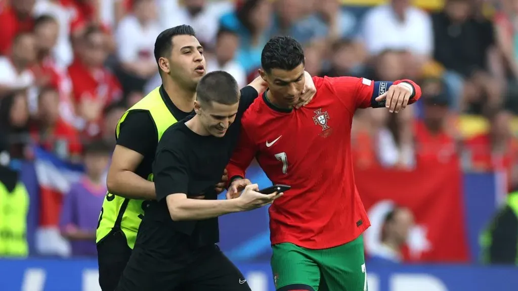 Cristiano Ronaldo with a fan during Portugal vs Turkey in UEFA Euro 2024