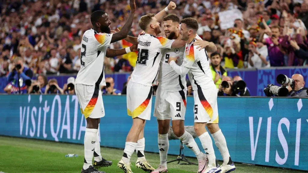 Niclas Fuellkrug of Germany celebrates scoring his team’s fourth goal with teammates Antonio Ruediger, Maximilian Mittelstaedt and Pascal Gross during the UEFA EURO 2024 group stage match between Germany and Scotland at Munich Football Arena on June 14, 2024 in Munich, Germany. Photo by Lars Baron/Getty Images