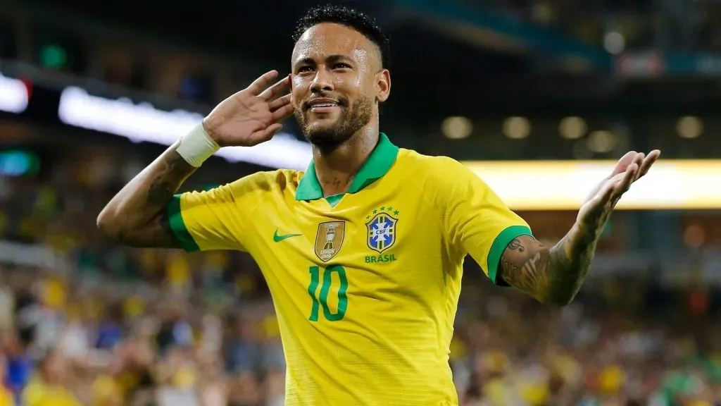 Neymar Jr. #10 of Brazil reacts after assisting Casemiro #5 on a goal against Colombia during the first half of the friendly. Photo by Michael Reaves/Getty Image