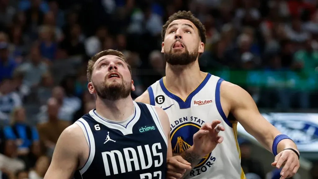 Luka Doncic #77 of the Dallas Mavericks and Klay Thompson #11 of the Golden State Warriors battle for position in the first half at American Airlines Center on March 22, 2023 in Dallas, Texas.