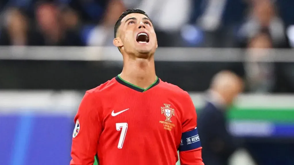 Cristiano Ronaldo of Portugal reacts as he prepares to take a free kick during the UEFA EURO 2024 round of 16 match between Portugal and Slovenia at Frankfurt Arena on July 01, 2024 in Frankfurt am Main, Germany.
