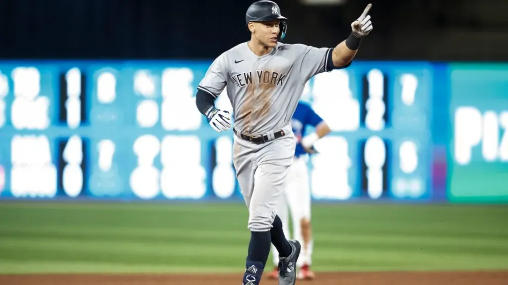 Aaron Judge #99 of the New York Yankees runs the bases as he hits his 61st home run of the season in the seventh inning against the Toronto Blue Jays at Rogers Centre. Photo by Cole Burston/Getty Images
