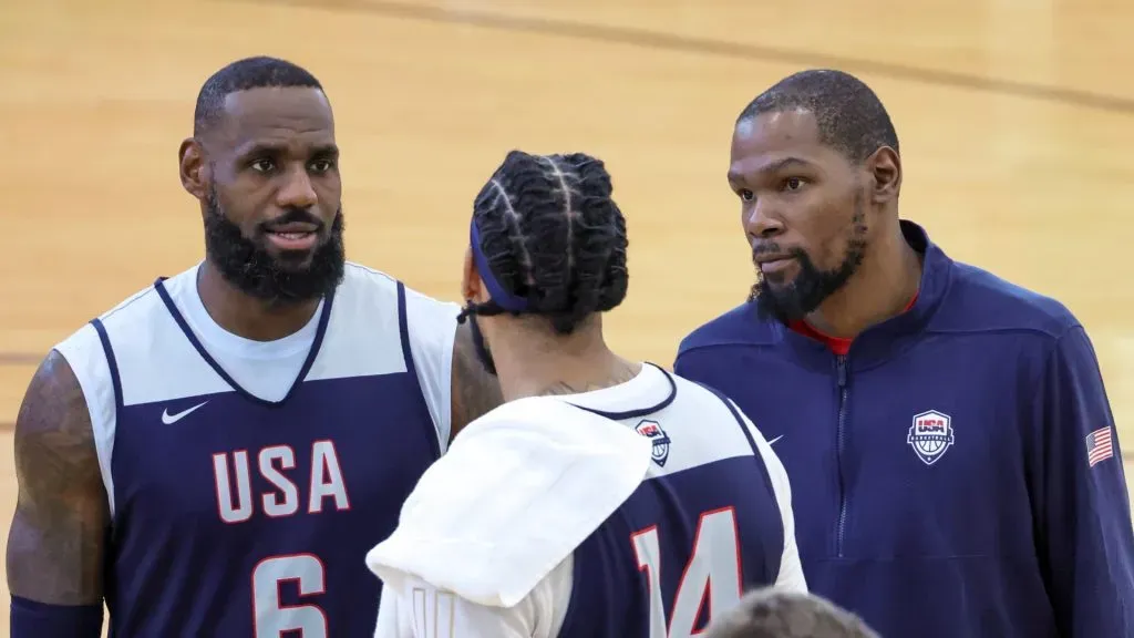 LeBron James #6, Anthony Davis #14 and Kevin Durant #7 of the 2024 USA Basketball Men’s National Team talk during a practice session at the team’s training camp. Photo by Ethan Miller/Getty Images