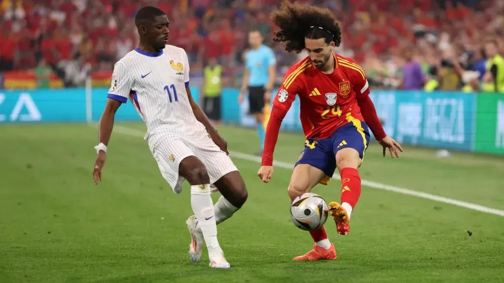 Marc Cucurella of Spain is challenged by Ousmane Dembele of France during the UEFA EURO 2024 Semi-Final match between Spain and France. Photo by Alex Grimm/Getty Images