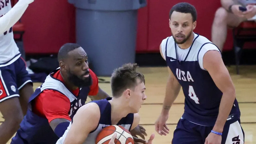 Cooper Flagg #31 of the 2024 USA Basketball Men’s Select Team drives to the basket against LeBron James #6 and Stephen Curry #4 of the 2024 USA Basketball Men’s National Team during a practice session scrimmage at the team’s training camp. Photo by Ethan Miller/Getty Images
