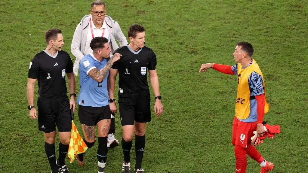 Jose Maria Gimenez of Uruguay argues with referee Daniel Siebert during the FIFA World Cup Qatar 2022 Group H match between Ghana and Uruguay at Al Janoub Stadium on December 02, 2022 in Al Wakrah, Qatar. Photo by Ryan Pierse/Getty Images.