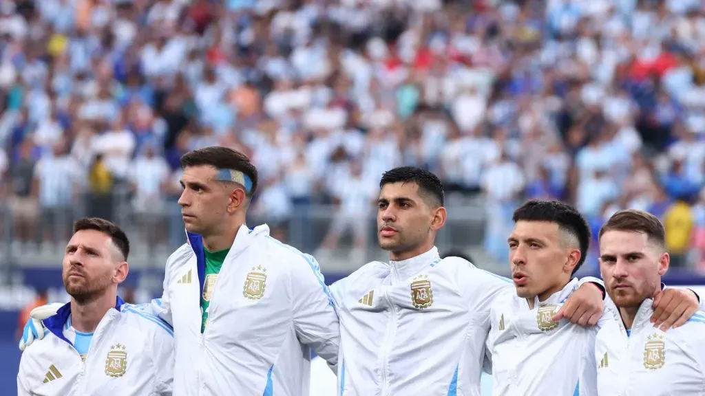 Lionel Messi, Emiliano Martinez, Cristian Romero, Lisandro Martinez and Alexis Mac Allister of Argentina sings the national anthem prior to the CONMEBOL Copa America 2024 semifinal match between Canada and Argentina. Meyer/Getty Images