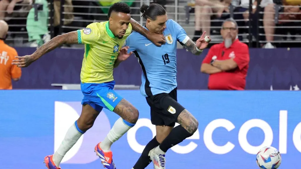 Darwin Nunez (R) of Uruguay dribbles the ball under pressure from Eder Militao of Brazil in the second half of a CONMEBOL Copa America 2024 quarterfinal match. Ethan Miller/Getty Images