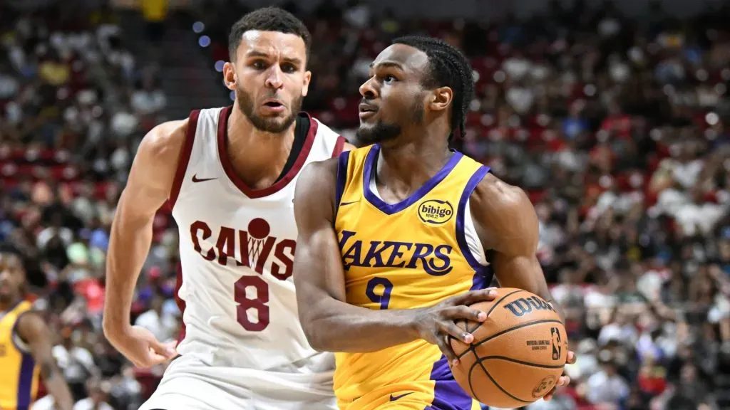 Bronny James Jr. #9 of the Los Angeles Lakers drives past Pete Nance #8 of the Cleveland Cavaliers during a 2024 NBA Summer League game. Candice Ward/Getty Images