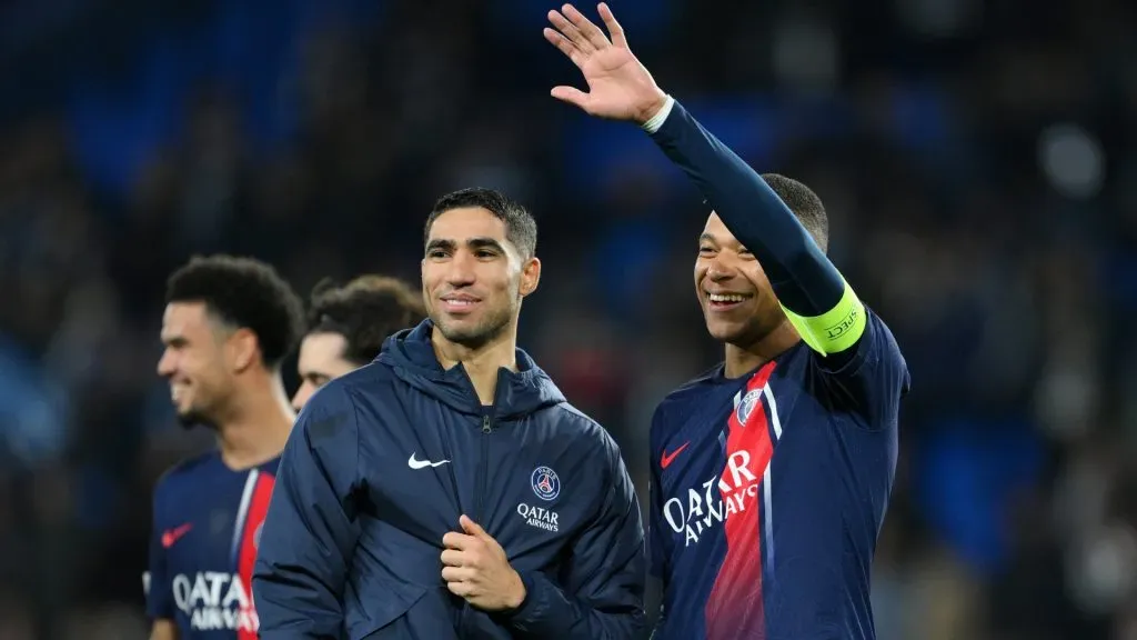 Achraf Hakimi and Kylian Mbappe of Paris Saint-Germain celebrate victory in the UEFA Champions League 2023/24 round of 16 second leg match between Real Sociedad and Paris Saint-Germain at Reale Arena on March 05, 2024 in San Sebastian, Spain. (Photo by David Ramos/Getty Images)