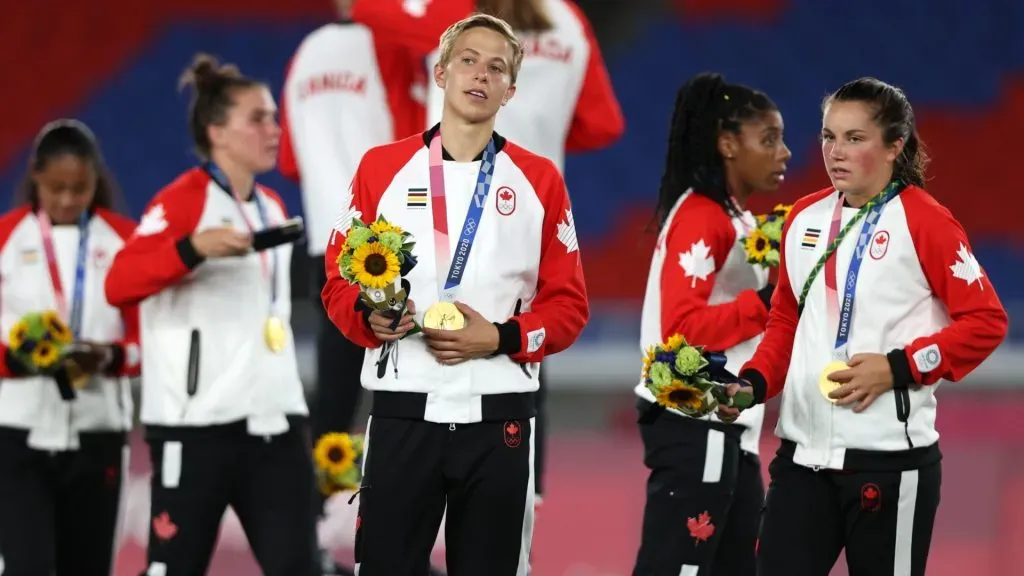 Gold medalist Quinn #5 of Team Canada reacts with their gold medal after becoming the first openly transgender athlete to win Olympic gold during the Gold Medal Match Women’s Football match between Canada and Sweden at International Stadium Yokohama on August 06, 2021 in Yokohama, Kanagawa, Japan. (Photo by Naomi Baker/Getty Images)
