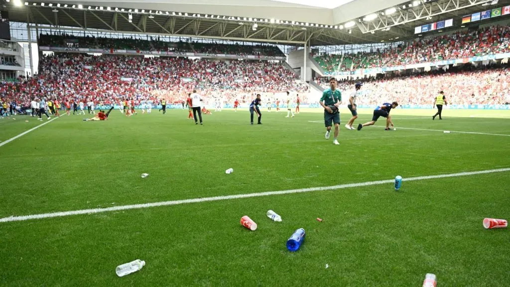 A general view inside the stadium as staff remove bottles from the pitch which had been thrown from the stands during the Men’s group B match between Argentina and Morocco during the Olympic Games Paris 2024 at Stade Geoffroy-Guichard on July 24, 2024 in Saint-Etienne, France.