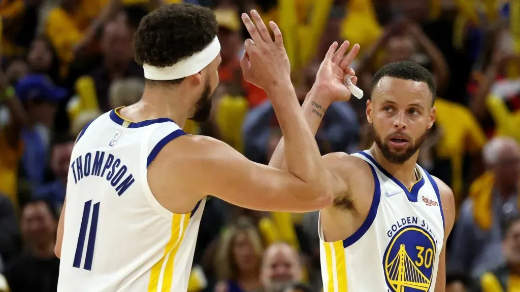 Stephen Curry #30 and Klay Thompson #11 of the Golden State Warriors celebrate a basket during the fourth quarter against the Dallas Mavericks in Game Two of the 2022 NBA Playoffs Western Conference Finals at Chase Center on May 20, 2022 in San Francisco, California.