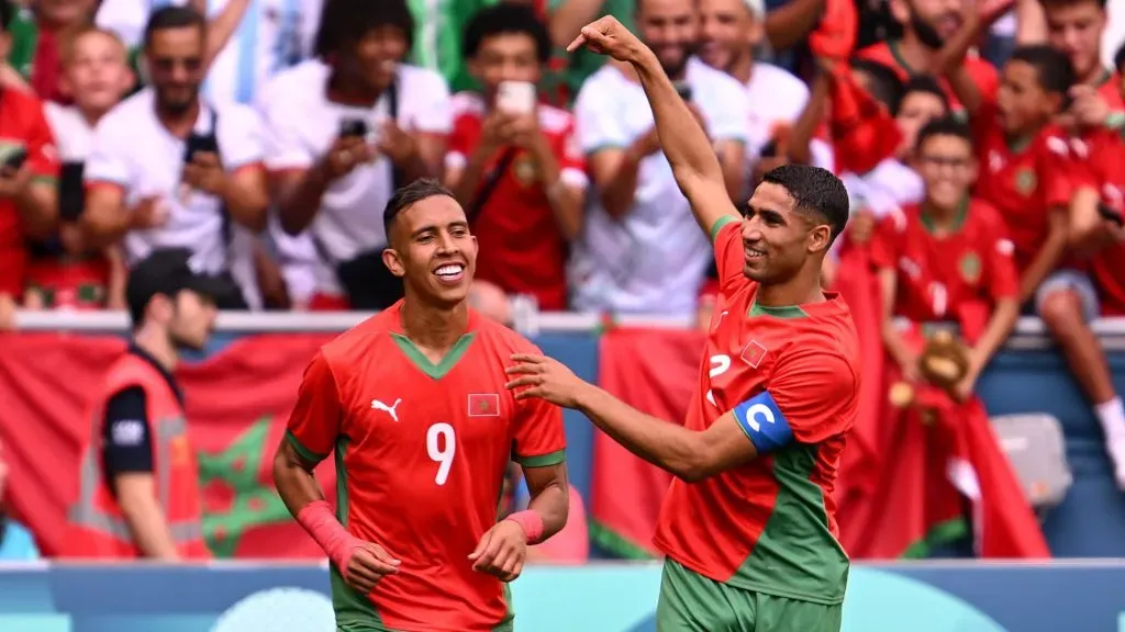 Soufiane Rahimi #9 of Team Morocco celebrates scoring his team’s first goal with teammate Achraf Hakimi #2 of Team Morocco during the Men’s group B match between Argentina and Morocco during the Olympic Games Paris 2024 at Stade Geoffroy-Guichard on July 24, 2024 in Saint-Etienne, France.