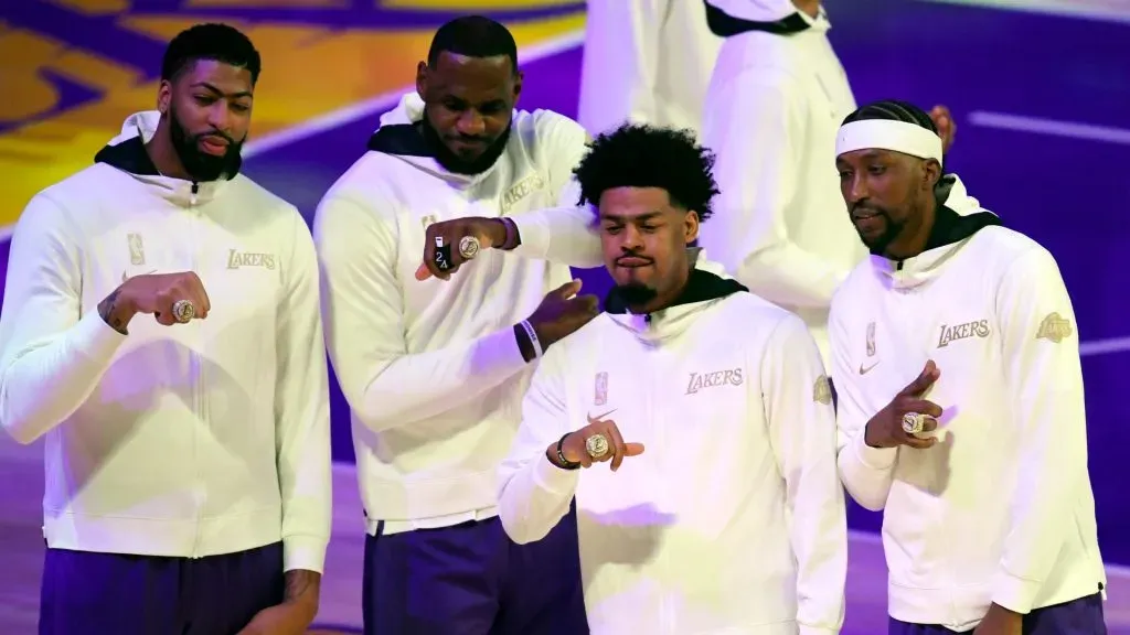Anthony Davis #3, LeBron James #23, Quinn Cook #2 and Kentavious Caldwell-Pope #1 of the Los Angeles Lakers pose during the 2020 NBA championship ring ceremony before their opening night game against the Los Angeles Clippers at Staples Center on December 22, 2020 in Los Angeles, California.