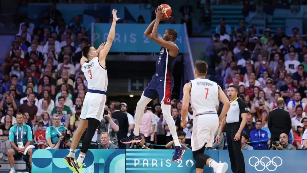 Kevin Durant #7 of Team United States shoots the ball against Filip Petrusev #3 of Team Serbia during the first half of the Men’s Group Phase – Group C game between Serbia and the United States. Gregory Shamus/Getty Images
