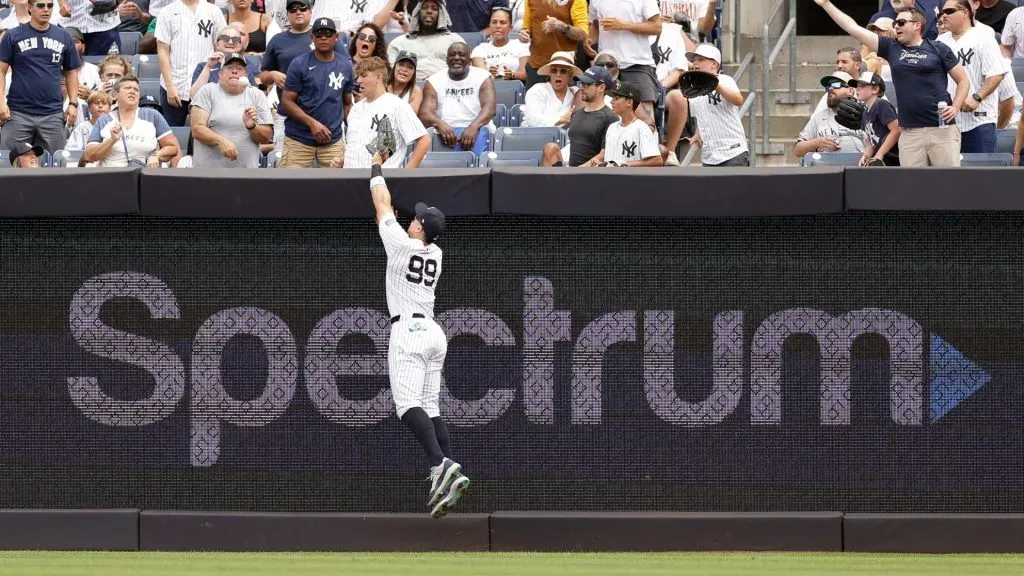 Aaron Judge #99 of the New York Yankees reaches for a 3-run home run hit by Alex Jackson #28 of the Tampa Bay Rays pitches during the fourth inning at Yankee Stadium on July 20, 2024 in New York City. (Photo by Adam Hunger/Getty Images)