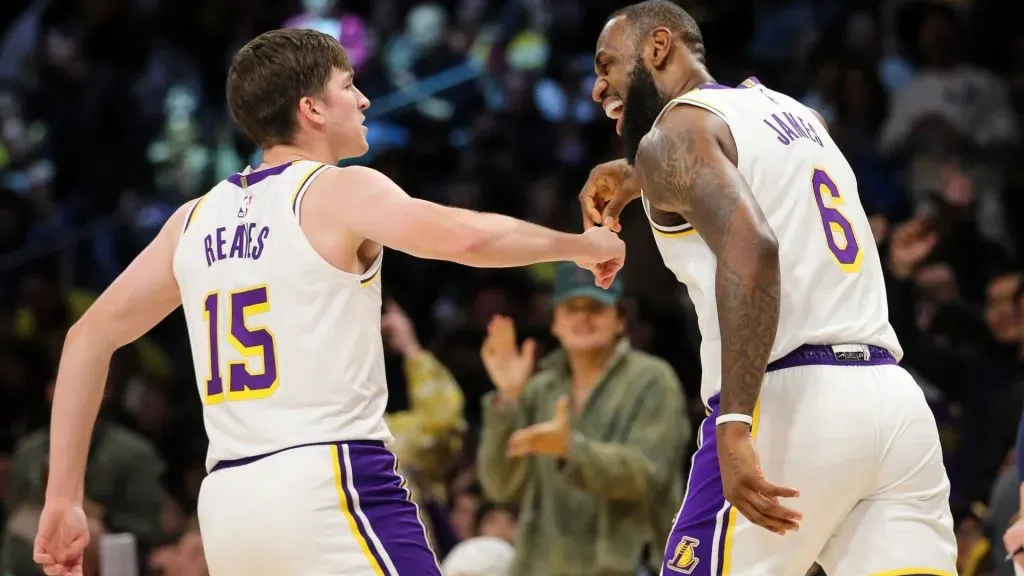 Austin Reaves #15 and LeBron James #6 of the Los Angeles Lakers celebrate their point in the first half against the Washington Wizards at Crypto.com Arena on December 18, 2022 in Los Angeles, California.