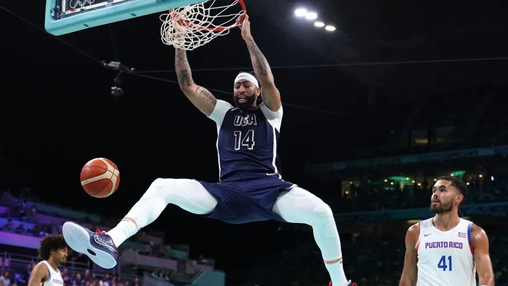 Anthony Davis #14 of Team United States dunks the ball during a Men’s basketball group phase-group C game between the United States and Puerto Rico. Gregory Shamus/Getty Images