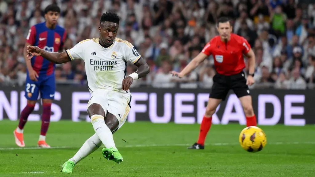 Vinicius Junior of Real Madrid scores his team’s first goal from the penalty spot during the LaLiga EA Sports match between Real Madrid CF and FC Barcelona at Estadio Santiago Bernabeu on April 21, 2024 in Madrid, Spain.
