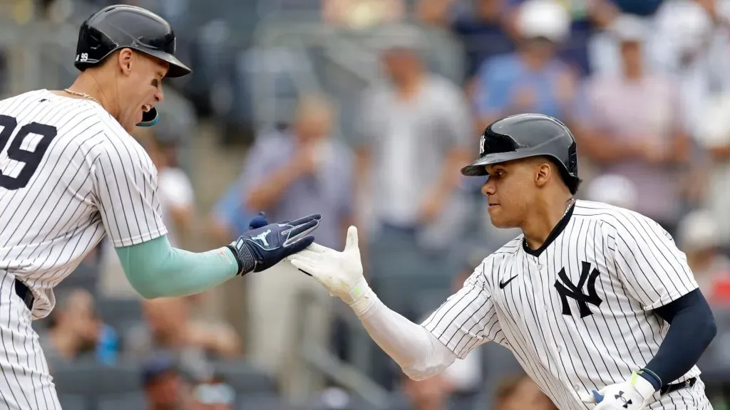 Juan Soto #22 of the New York Yankees is congratulated by Aaron Judge #99 of the New York Yankees after hitting a solo home run. (Photo by Adam Hunger/Getty Images)