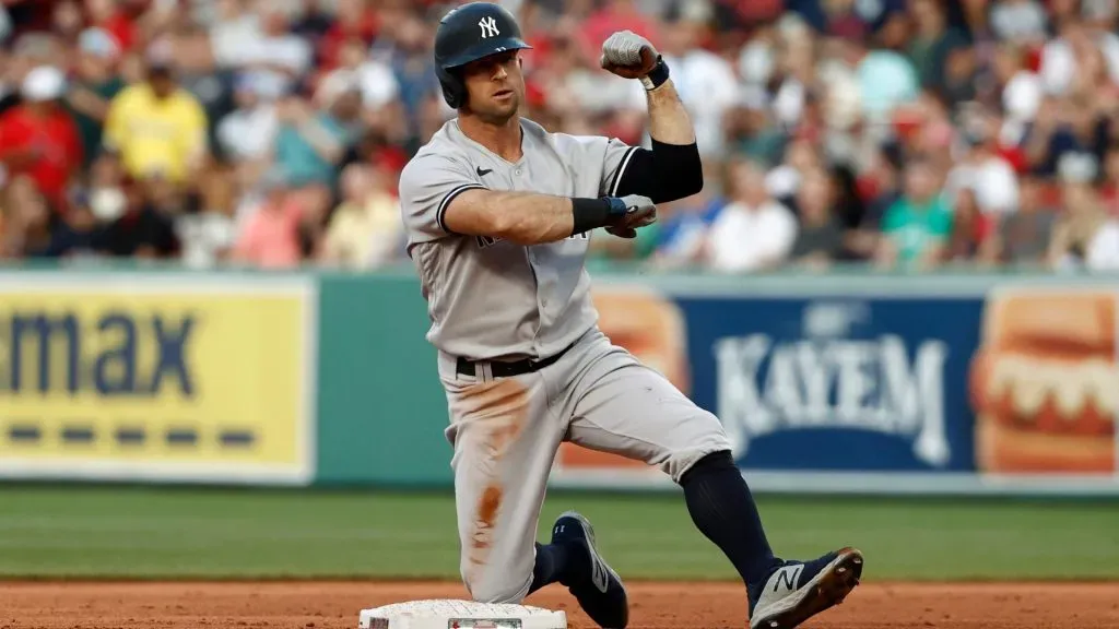 Brett Gardner #11 of the New York Yankees flexes his muscle at second base after his RBI double against the Boston Red Sox during the second inning at Fenway Park on July 23, 2021 in Boston, Massachusetts. (Photo By Winslow Townson/Getty Images)