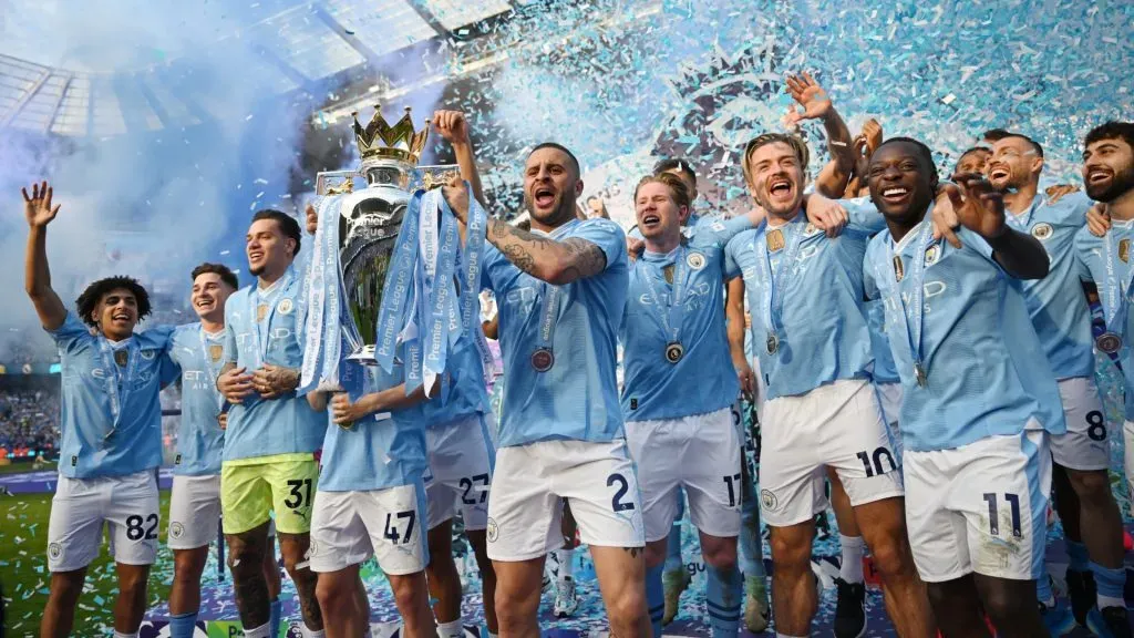 Kyle Walker of Manchester City lifts the Premier League trophy after the Premier League match between Manchester City and West Ham United at Etihad Stadium on May 19, 2024 in Manchester, England. (Photo by Michael Regan/Getty Images)