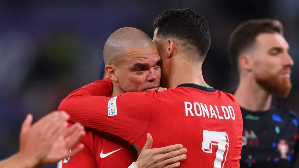 Pepe of Portugal is consoled by teammate Cristiano Ronaldo following the team’s defeat in the penalty shoot out during the UEFA EURO 2024 quarter-final match between Portugal and France at Volksparkstadion on July 05, 2024 in Hamburg, Germany.