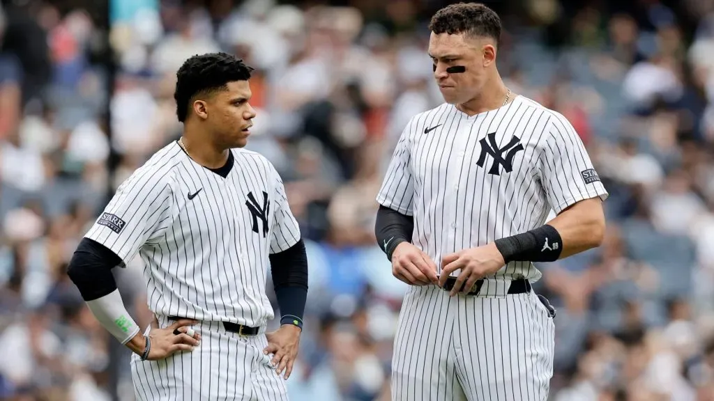 Juan Soto #22 and Aaron Judge #99 of the New York Yankees talk on the field after both were stranded on base after the fifth inning against the Seattle Mariners at Yankee Stadium. (Photo by Jim McIsaac/Getty Images)