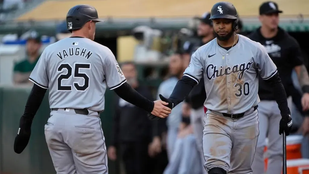 Andrew Vaughn #25 of the Chicago White Sox is congratulated by Corey Julks #30 after Vaughn scored against the Oakland Athletics in the top of the fourth inning at the Oakland Coliseum on August 5, 2024 in Oakland, California. (Photo by Thearon W. Henderson/Getty Images)