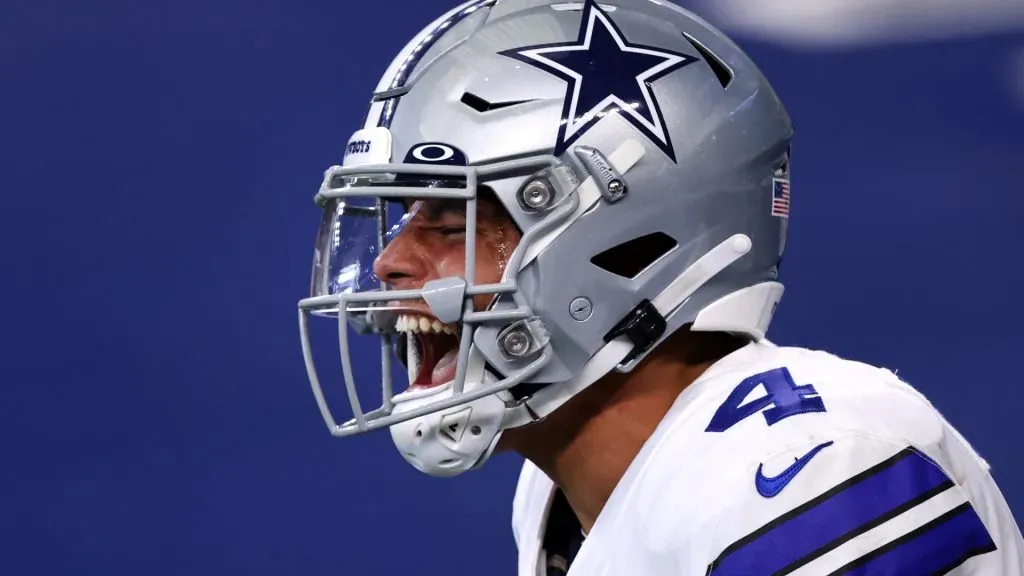 Dak Prescott #4 of the Dallas Cowboys celebrates his touchdown reception against the New York Giants during the second quarter at AT&T Stadium on October 11, 2020 in Arlington, Texas.