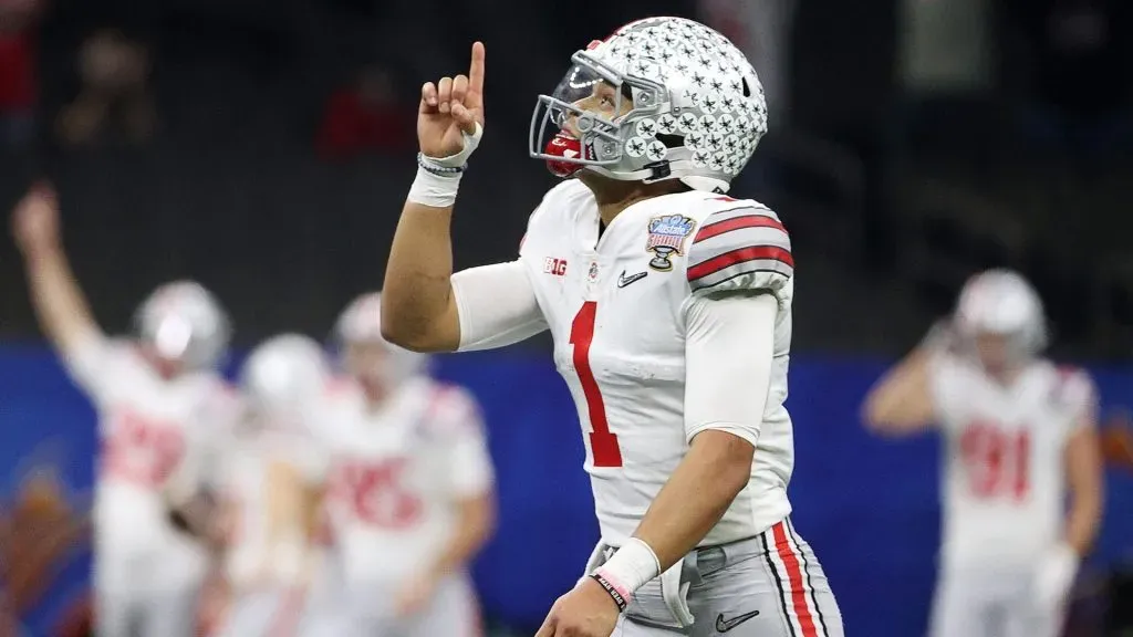 Justin Fields #1 of the Ohio State Buckeyes reacts after a touchdown pass against the Clemson Tigers in the first half during the College Football Playoff semifinal game at the Allstate Sugar Bowl at Mercedes-Benz Superdome on January 01, 2021 in New Orleans, Louisiana.