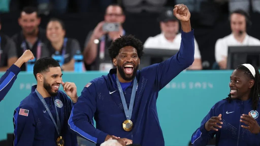 Gold medalist Joel Embiid #11 of Team United States celebrates on the podium during the Men’s basketball medal ceremony. Jamie Squire/Getty Images