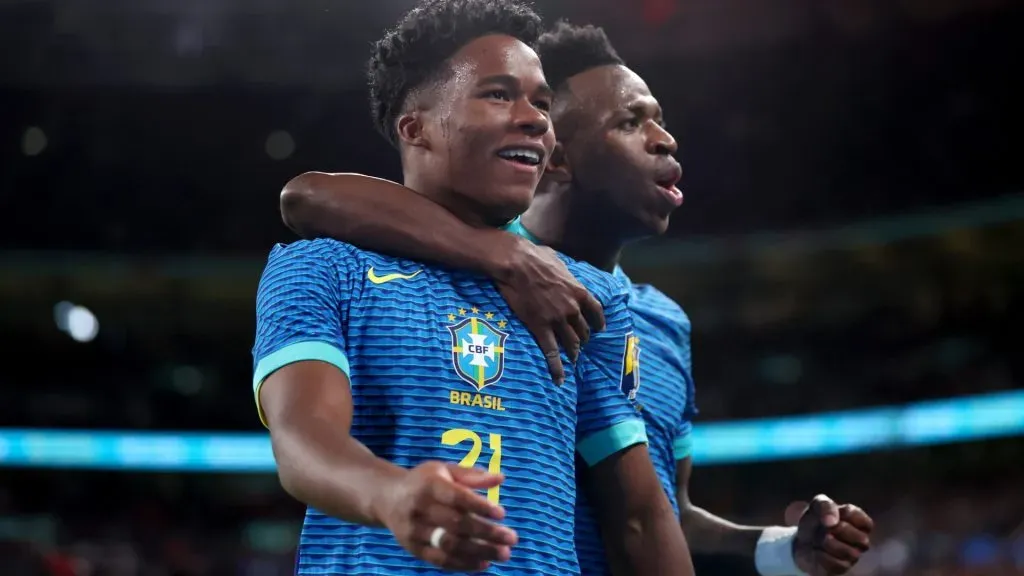 Endrick of Brazil celebrates scoring his team’s first goal with teammate Vinicius Junior during the international friendly match between England and Brazil at Wembley Stadium on March 23, 2024 in London, England.