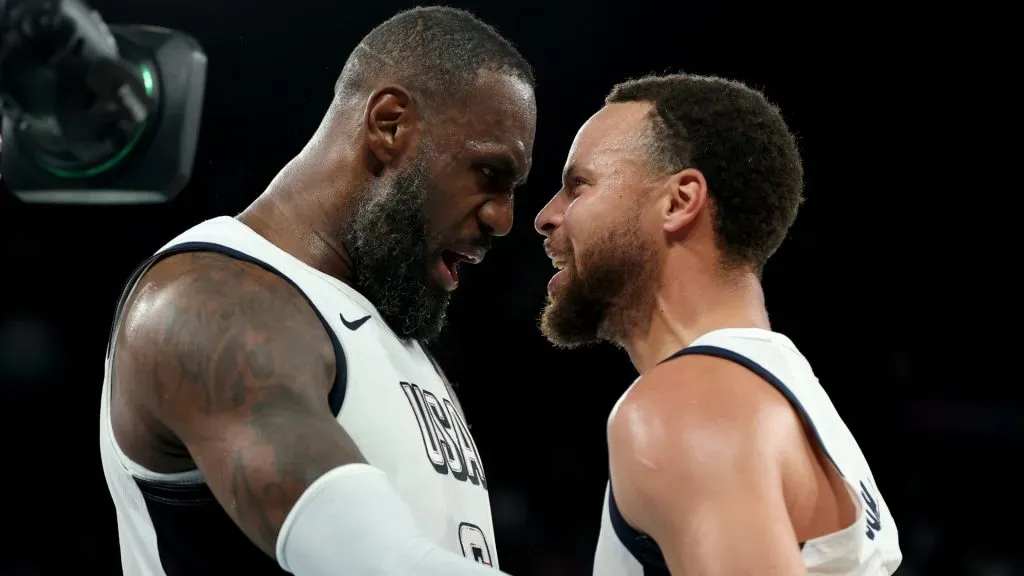 Lebron James #6 and Stephen Curry #4 of Team United States celebrate after their team’s win against Team Serbia during a Men’s basketball semifinals match between Team United States and Team Serbia on day thirteen of the Olympic Games Paris 2024 at Bercy Arena on August 08, 2024 in Paris, France.